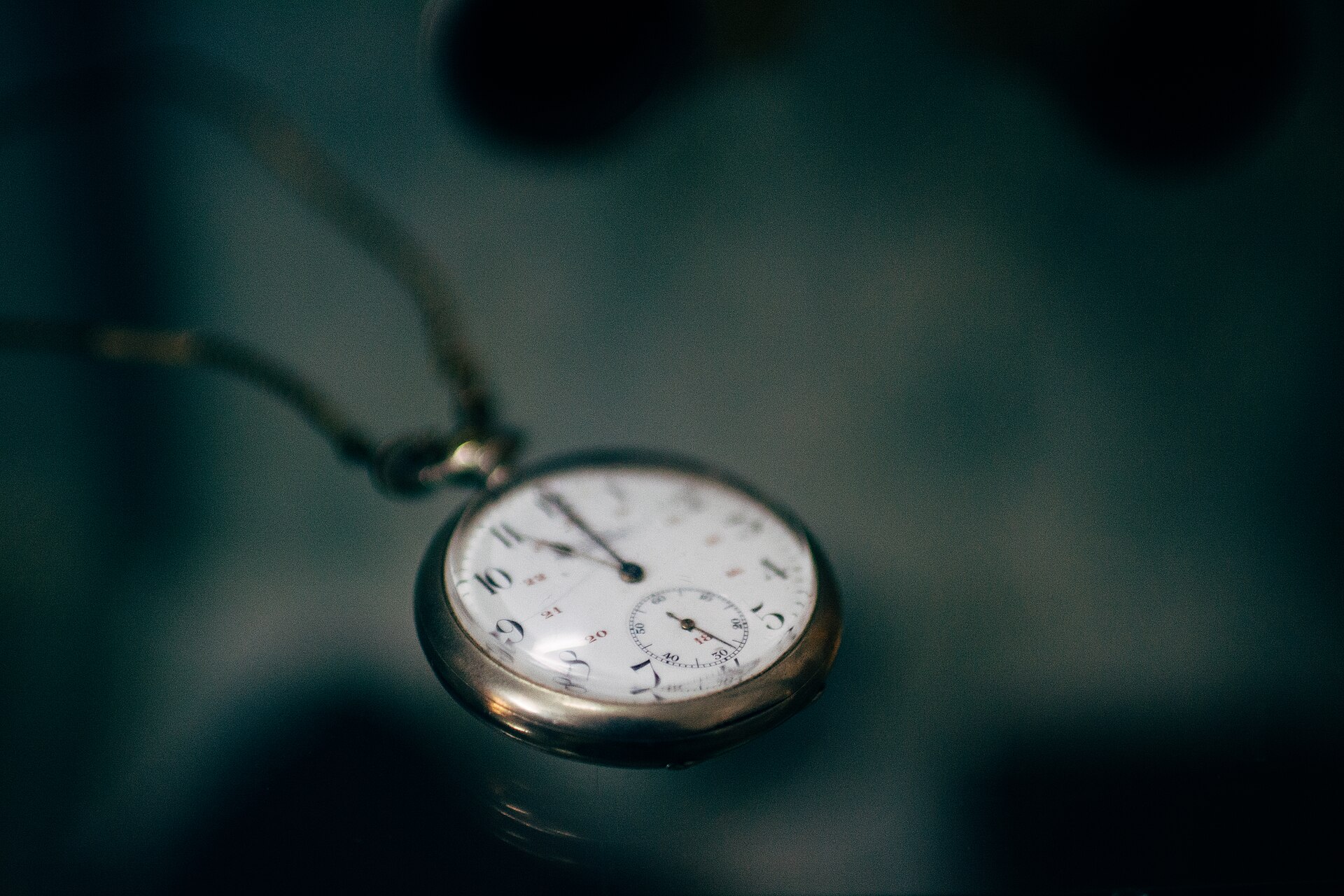 Old pocket watch representing the coverage period in term vs whole life insurance