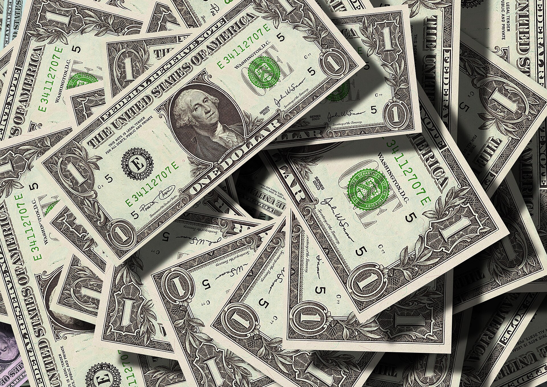 Stacks of dollar bills illustrating zero-based budgeting where every dollar gets a job