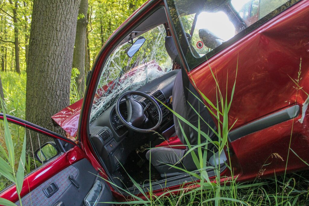 Damaged car after hitting a tree, the kind of collision claim where car insurance deductibles apply