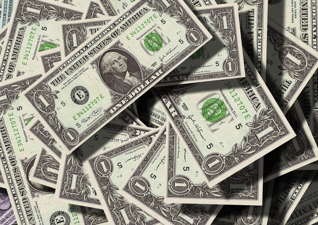 Stacks of dollar bills illustrating zero-based budgeting where every dollar gets a job